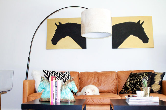 A modern equestrian influenced living room with a DIY cowhide lampshade