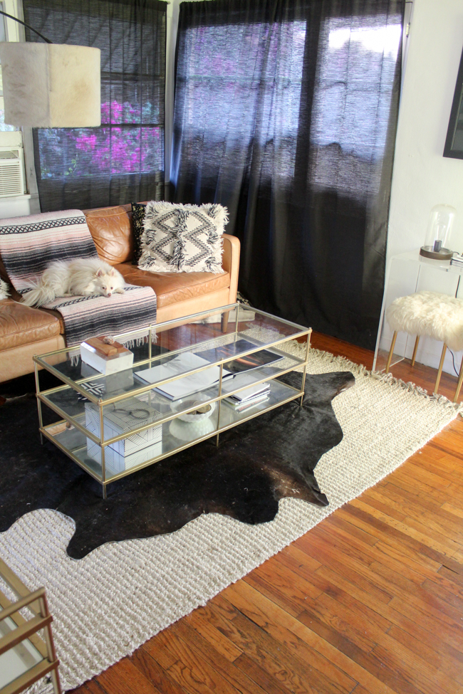 how to layer rugs with cowhide