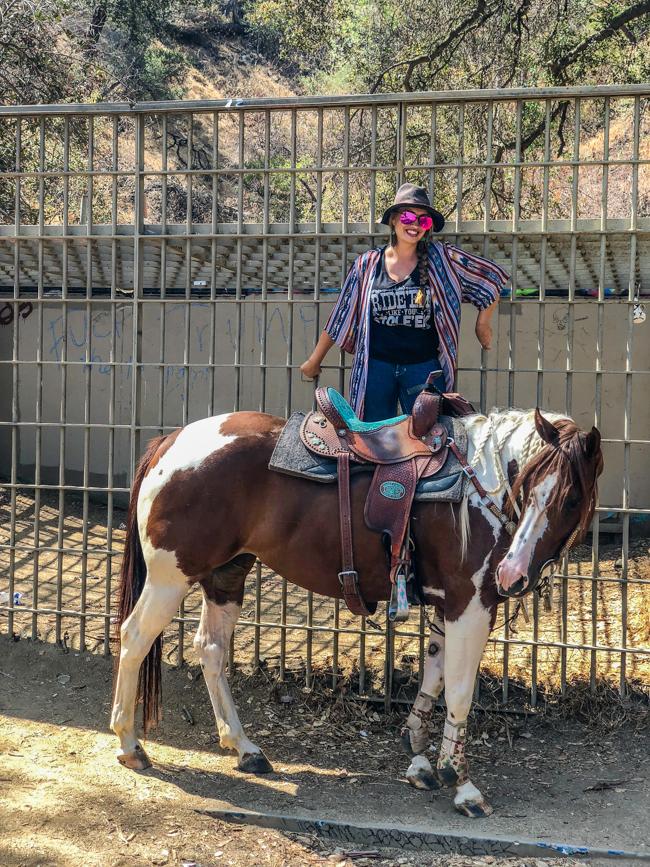 striking a pose in front of an old cage at the old zoo